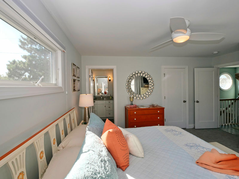 about-5011-west22-R Primary bedroom with coastal colors and elements.